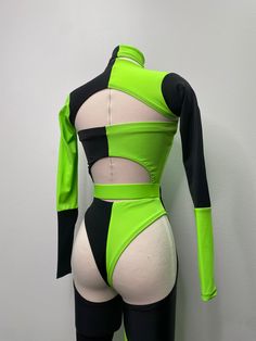 Note: Leggings and garters are interchangeable, with the green belt. Leggings and garters have a fold that insert into the belt so you can switch it out for the garters. If you're a fan of Shego from the popular animated series, you'll love this Shego-inspired cosplay/Halloween outfit. With its sleek black and green design, this outfit is perfect for any fan of the iconic villainess. The form-fitting bodysuit is made of high-quality materials that will keep you comfortable and looking great all Fitted Green Cosplay Costume, Green Fitted Cosplay Costume, Black Stretch Rave Unitard, Green Stretch Long Sleeve Unitard, Green Long Sleeve Stretch Unitard, Fitted Green Cosplay Costume For Halloween, Fitted Green Costume For Cosplay Events, Fitted Green Halloween Cosplay Costume, Fitted Green Cosplay Costume For Costume Party