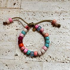 These bracelets and necklaces are a collection based around a rainbow of gemstone pony beads. Paired with the Mini Seeds in photo. Add-on stones can be purchases additionally here, please specify if you want your add on strung on your bracelet in the personalization comments. If left blank it will be sent separately: https://www.etsy.com/listing/946252171/bracelet-add-ons?ref=shop_home_active_4 All of my cords are one size fits all. Stones are subject to availability and may be substituted when necessary. Precious gems are formed in different ways and composed of different materials, meaning their appearances vary vastly. Gems may be treated to enrich color. Recommended to be stacked with many! Beaded with love ❤️. Friendship Crystal Bracelet With Gemstone Beads, Rainbow Natural Stones Beaded Bracelets For Jewelry Making, Multicolor Agate Beaded Bracelets With Round Beads, Multicolor Agate Beaded Bracelets, Bracelets With Gemstone And Heishi Beads, Gemstone Beads Round Friendship Bracelets, Colorful Agate Beaded Bracelets, Colorful Heishi Beads Jewelry For Friendship, Multicolor Agate Beaded Bracelets With Colorful Beads