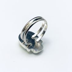 This is a cute skull ring made with a 18 X 14mm Swarovski AB Crystal set in Sterling Silver. The setting is handcrafted in our own studio. We handcraft these rings one at a time for each customer. Available in any size from 5 to 12 and any size in between. The ring is made with a hand formed double band. These settings are custom made by Steve in our studio using laser and gas welding techniques. Crystals are professionally set and not glued. This ring is made to last. Nickel-free Skull Rings For Gift, Handmade Adjustable Butterfly Ring, Unique Nickel-free Skull Ring Gift, Adjustable Silver Skull Ring Collectible, Unique Nickel-free Skull Ring, Unique Skull Rings For Gifts, Adjustable 925 Stamped Skull Ring For Gift, Handmade Skull Ring As Gift, Handmade Skull Ring Gift