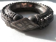 Gorgeous Hefty Ethnic Tribal Spiked Yemeni silver bracelet/bangle with very intricate workmanship and in very good condition with no broken or missing spikes. Collectors piece made in the early 1900s by tribes in Southern Arabia and Northern Africa. These type of bracelets are perfectly wearable and were often given on the occasion of the wedding to the bride  Dimensions: outer diameter 4.5" _  inner diameter 2.5" outer circumference 13.5"  _  inner wearable circumference 8"  1" tall  _  Weighs 163.7 Grams Any questions please ask! Shipped with USPS First Class Package.  Handsome African design.  Please browse the gallery to see our inventory.  Just Gorgeous!  Please refer to photos for more details on markings, size and condition. All weights, measurements and colors are approximate and m Heavy Silver Bracelet For Festivals, Metal Bangle With Intricate Design For Festival, Heavy Silver Bracelets For Festivals, Traditional Metal Bangle Bracelets, Traditional Sterling Silver Bracelet, Ornate Oxidized Cuff Bracelet Bangle, Ornate Oxidized Bangle Cuff Bracelet, Bohemian Bracelets With Intricate Design For Festivals, Bohemian Bangle With Intricate Design For Festivals