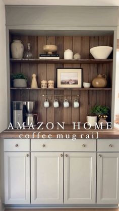 an open bookcase with coffee mugs and vases on it in the kitchen