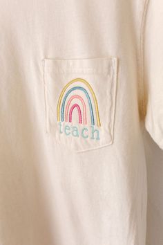 Go back to school in style! Pair this tee with your favorite pair of jeans, or your favorite skirt! I think this would also wear well with a cute cardigan! This rainbow teach pocket tee was designed to be a versatile piece for every teacher's wardrobe! Comfort Colors is unisex sized. This means the sizing is boxy, not fitted like women's, but it is not oversized. It is true to size. Tee Specifications: 6.1 oz., 100% ring spun cotton Soft-washed garment-dyed fabric Double-needle collar Twill tape Preppy Cotton T-shirt With Letter Print, Preppy Cotton Tops With Letter Print, White Cotton T-shirt For School, Preppy Short Sleeve T-shirt For School, School T-shirt With Embroidered Crew Neck, Preppy Short Sleeve School T-shirt, School Crew Neck Embroidered T-shirt, Cotton T-shirt With Embroidered Text For School, Casual Tops With Embroidered Text For School