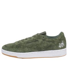 The Reebok Curren$y x Club C 85 'Jet Life' is a special edition sneaker from the popular rapper and Reebok. This low-top sneaker comes in a primal green suede upper with hemp fiber laces, kangaroo pouch liner on the tongue, and 'Jet Life' lettering on the heel. It also boasts Reebok branding on the heel and a hemp gum outsole. This sneaker is perfect for fans of Curren$y or anyone who loves a good quality sneaker. (SNKR) Club C Reebok, Popular Rappers, Hemp Fiber, Club C 85, Reebok Club C, Club C, Kangaroo Pouch, Green Suede, Low Top