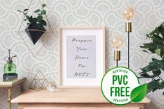 a wooden table topped with plants next to a white framed sign that says prepare your home for bet