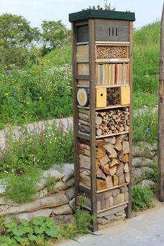 there is a book shelf made out of firewood