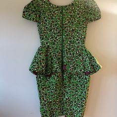 This Stunning Authentic Hand Made African Dress In Vibrant Green And Magenta Print Is Straight From Nigeria. Featuring A Split Peplum Waist, Generous Exposed Zipper, Vent For Ease Of Wear, Lining, And Bust Padding. My Husband Is Nigerian And My Sweet Mother In Law Gifted Me This Dress The Last Time She Came To Visit. I Absolutely Love The Style And The Vibrant Green Print! Unfortunately, Though, I Am Very Long And Lanky And This Dress Proved To Be Very Ill Fitting For My Height...Beyond The Abil Multicolor Peplum Dress For Party, Multicolor Fitted Peplum Dress, Green Peplum Party Dress, Green Short Sleeve Cocktail Dress, Fitted Floral Print Peplum Dress, Custom Made Dress, Cowl Dress, Made Dress, Disco Dress