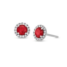 Command attention with our white gold stud earrings, highlighting vibrant rubies encircled by halos of sparkling diamonds. Statements are made with these luxurious earrings. Ruby Halo Setting Earrings In Fine Jewelry, Ruby Halo Setting Earrings Fine Jewelry, Ruby Halo Earrings In Fine Jewelry Style, Ruby Earrings With Halo Setting In Fine Jewelry, Ruby Halo Setting Earrings, Classic Red Earrings With Halo Setting, Anniversary Ruby Earrings With Halo Setting, White Gold Ruby Earrings With Halo Design, Red Round Halo Design Earrings