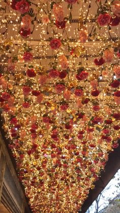 the ceiling is decorated with lights and flowers