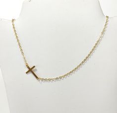 Cross gold steel necklace, Layering jewelry, Religion cross choker, Gold necklace, Minimalist jewelry, Dainty cross choker, Tiny necklace Beautiful simple necklace with gold stainless steel cross and steel chain. Simple choker or everyday wear Length 42cm  The necklace will be delivered inside a craft jewelry box. JEWELRY CARE: Please take care of your jewelry do not wear in the shower, swimming pool, or to bed. Keep away from harsh chemicals and cleaners. It is always best to put on your jewelr Minimalist Cross Pendant Chain Necklace As Gift, Minimalist Chain Necklace With Cross Pendant As Gift, Minimalist Cross Chain Necklace With Delicate Chain, Minimalist Delicate Chain Cross Necklace, Minimalist Clavicle Cross Chain Jewelry, Minimalist Gold Chain Necklace With Cross Pendant, Minimalist Jewelry With Adjustable Chain And Cross Pendant, Gold Adjustable Minimalist Cross Necklace, Dainty Gold Cross Chain Necklace