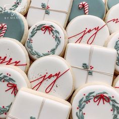 many decorated cookies with red and green decorations