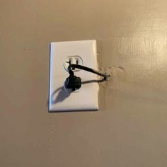 an electrical outlet is shown with wires attached to the wall and plugged into it