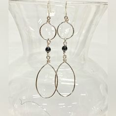 Elevate Your Style With These Exquisite Handmade Dangle Statement Earrings. Handcrafted With Silver Tone Tarnish-Resistant Jewelry Wire And Adorned With Genuine Hematite Beads, They Exude Elegance And Sophistication. Suspended From Sterling Silver French Hook Ear Wires, They Offer Both Style And Comfort. Hematite, Known For Its Healing Properties And Ability To Ward Off Negative Energies, Adds A Unique Touch. Associated With The Root Chakra, These Earrings Promote Grounding, Security, And Safety Modern Silver Teardrop Chandelier Earrings, Silver Wire-wrapped Dangle Linear Earrings, Silver Metal Teardrop Earrings Wire Wrapped, Silver Wire Wrapped Dangle Linear Earrings, Silver Metal Wire Wrapped Teardrop Earrings, Silver Wire Wrapped Metal Teardrop Earrings, Silver Teardrop Wire Wrapped Chandelier Earrings, Silver Wire-wrapped Sterling Silver Linear Earrings, Silver Wire Wrapped Linear Earrings In Sterling Silver