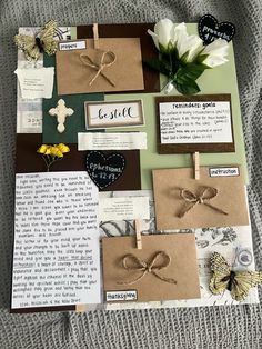 a collage of cards, flowers and other items are arranged on top of a blanket