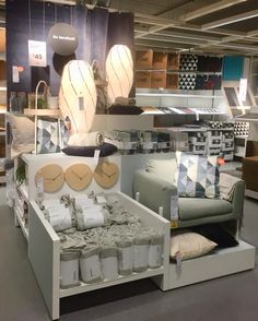 a room filled with lots of different types of furniture and decor on display at a store