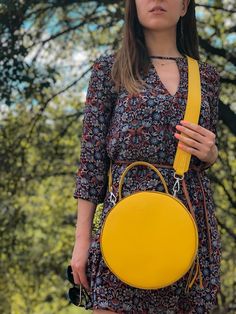 A round tote  bag  with a handle will help to emphasize your femininity, it will always effectively emphasize your image and will help to free your hands from the little things that always clutter up your pockets.The leather work tote bag not only complements your style, but also becomes a roomy bag for every day, work or walk.The yellow color of the skin, the quality of work, the silhouette of the bag are created for a true connoisseur of beauty.Product information: * soft Italian leather * ski On-the-go Satchel With Round Handle, On-the-go Shoulder Bag With Round Handle, Daily Use Shoulder Bag With Round Handle, Round Shoulder Bag For Travel, Round Case Bag With Detachable Handle, Shoulder Bag With Detachable Handle For Daily Use, Everyday Bags With Adjustable Strap And Round Case, Everyday Bag With Adjustable Strap And Round Case, Chic Round Bags For Daily Use