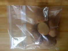 a packaged food item sitting on top of a wooden table next to a plastic bag