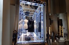 an open display case with mannequins in it