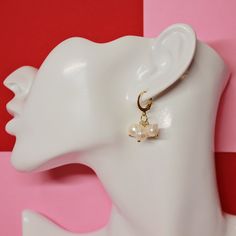 Meet our dainty 18K Stainless Steel Freshwater Pearl Huggie Earrings. She's made with a pair of 18K gold plated huggies with freshwater pearl accents. She's the perfect accessory for a minimalist gal.  handmade tarnish-resistant hypoallergenic All necklaces, bracelets, and anklets are made out of 18k gold stainless steel chains and/or components. All earring components are made out of 18K gold plated stainless steel.  Each purchase includes a velvet pouch for you to store your jewelry in, cleaning cloth, butterfly stickers, & butterfly keychain. It is recommended to keep your jewelry stored in your pouch to preserve its beauty.  All images were taken and edited by me. Gold Hypoallergenic Pearl Huggie Earrings, Pearl Drop Huggie Earrings As Gift, Gift Yellow Gold Huggie Earrings With Pearl Charm, Yellow Gold Huggie Earrings With Pearl Charm As Gift, Hypoallergenic Huggie Pearl Earrings Gift, Dainty Pearl Charm Huggie Earrings For Gifts, Dainty Pearl Charm Huggie Earrings As Gift, Dainty Huggie Earrings With Pearl Charm As Gift, Pearl Huggie Earrings As Gift