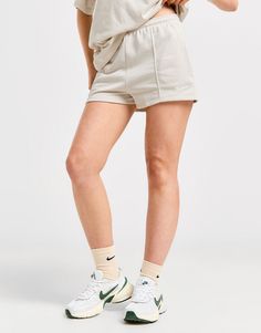 Bringing luxe energy to your laidback styles, cop these women's Essential Sportswear Chill French Terry Shorts from Nike. In a Light Orewood Brown colourway, these regular-fit shorts are made with a super-soft French terry cotton and polyester blend for lasting comfort. They have an elastic waistband with a drawstring to adjust the fit, and side pockets for quick and easy storage. Finished with pin tuck detailing and signature Swoosh branding. Machine washable. | Our model is 5'7" and wears a size small. Nike React Vision, 270 Nike, French Terry Shorts, Women Essentials, Grey Nikes, Jd Sports, Easy Storage, Chucks Converse, Workout Shorts