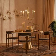 a dining room table with chairs and a chandelier