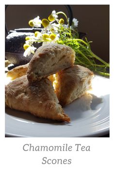 a white plate topped with scones covered in cheese