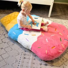 Three scoops of snuggly, fluffy fun - grab a sweet treat and cozy up on our new Inflatable Ice Cream Fluffy Floor Cushion. This jumbo 5-foot tall floor pillow features a plush, ultra-soft cover in a decadent triple scoop ice cream cone design, and a durable inflatable cushion insert made from heavy duty phthalate-free PVC. The Multi-colored sprinkles and sweet pastel shades will take your child’s imagination on a joy ride through candyland! Set up is a breeze with the included heavy duty air pum Ice Cream Cone Design, Scoop Ice Cream, Cone Design, Joy Ride, Cushion Inserts, American Leather, Sewing Toys, Pastel Shades, Play Mat