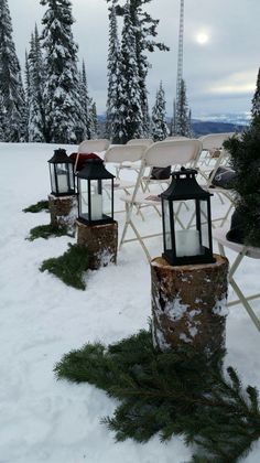 there are many chairs and lights in the snow