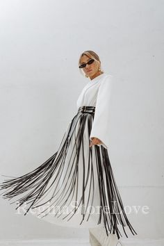 Step into the world of bohemian chic with our stunning Belt with Fringe. This fashion-forward accessory is the perfect addition to elevate your dress, accentuate your waist, and make a bold fashion statement. Crafted with care and attention to detail, this fringe belt exudes a sense of effortless style and adds a touch of flair to any outfit. Choose from an array of captivating colors to match your personal style and wardrobe. From classic black and timeless brown to vibrant red, feminine pink, Blue Fringe Belt, Elegant Party Skirt With Tassels, Bohemian Fall Party Skirt, Long Skirt With Tassels For Spring, Chic Skirt With Tassels For Spring, White Tassel Skirt For Spring, Elegant Summer Skirt With Tassels, Spring Long Skirt With Tassels, Elegant Fringe Skirt For Evening