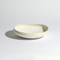 a white bowl sitting on top of a table