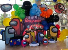 an assortment of balloons and decorations for a birthday party