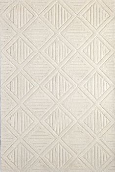 a white rug with diamond shapes on it