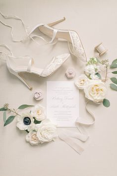 a wedding suite with shoes and flowers on the floor