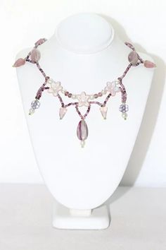 Vintage handmade necklace featuring beautiful designing of rose quartz and amethyst gemstones. This necklace is measured 16 inches long with lobster clasp. The necklace has also been checked for authenticity by a professional. Handmade Pink Amethyst Necklaces, Handmade Pink Amethyst Necklace, Pink Beaded Amethyst Necklace, Handmade Purple Rose Quartz Jewelry, Pink Amethyst Gemstone Necklace, Amethyst And Rose Quartz, Marquise Ring, Rose Quartz Necklace, Ring Photos