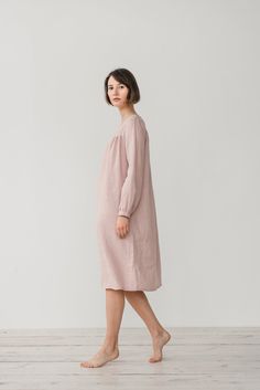 "MONA gather dress made from soft linen in dusty pink. - length is ± 107 cm (42\") (depends on size) - gathered front, back and sleeves - loose fit - without pockets DETAILS: - 100 % European, pre-washed medium weight linen (205 g/m²) - the model is 176 cm (5′9″) high, wearing size S. - model measurements: bust 83 cm (33\") / waist 61 cm (24\") / hips 90 cm (36\") - color in the picture - dusty pink (you can choose other color on the right) MADE TO ORDER: All pieces are made to order, it will ta Long Sleeve Bedtime Dress For Spring, Pink Long Sleeve Dresses For Night, Casual Long Sleeve Bedtime Dress, Feminine Long Sleeve Dress For Sleepover, Feminine Long Sleeve Sleep Dress, Pink Relaxed Fit Dress For Daywear, Beige Home Dress For Spring, Beige Spring Home Dress, Spring Long Sleeve Dresses For Home