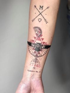 a person's arm with a tattoo on it and an arrow in the middle