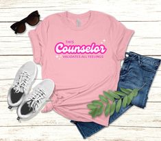 "Rock your counselor pride in this cute shirt featuring a super trendy girlie design.  This t-shirt also makes a wonderful gift for the pink loving counselor in your life or for a recent counseling grad student or someone who just earned their counseling license or LPC.  Flat lay mockups are shown in the colors \"pink\" and \"true heather royal.\"  Please note: all images are mockups intended to provide a general idea of what the final product will look like.  Actual product may vary slightly in Trendy Pink T-shirt With Funny Text, Pink Relaxed Fit T-shirt With Slogan, Social Worker Tshirt, Social Justice Shirts, Counselor Shirt, Social Worker Gifts, Girl Power Shirt, Grad Student, Feminist Shirt