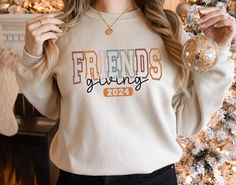 Friendsgiving Sweatshirt, Thanksgiving Friends Sweatshirt, Friends Sweatshirt, Thanksgiving Sweatshirt, The One With The Besties, Gift her Heather sport colors: 60/40 polyester/cotton 2-end mid weight fleece fabric Classic fit Air jet yarn for a softer feel and reduced pilling Double-needle stitching at shoulders, armholes, neck, waistband, and cuffs 1x1 rib with spandex for enhanced stretch and recovery Tear away label Fall Letter Print Hoodie As Gift, Fall Letter Print Hoodie Gift, Fall Hoodie Sweatshirt As Gift, Fall Season Hoodie Sweatshirt As A Gift, Fall Sweatshirt Hoodie As A Gift, Thanksgiving Friends, Friends Giving, Thankful Sweatshirt, Friends Thanksgiving