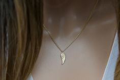 "Dainty angel wing necklace-gold-silver-guardian angel-Holiday gift ideas-gift for mom-Memorial gift Wing Necklace-single wing necklace length: 16\" + 2\" extension as shown in the pictures  pendant size: 5mm x 15mm material:gold dipped, white gold dipped lobster clasp available... gold, silver comes with gift box View other angel wing jewelry: https://www.etsy.com/shop/DearMia?ref=seller-platform-mcnav&search_query=angel+wing View more jewelry HERE: https://www.etsy.com/shop/DearMia?ref=shopsec Yellow Gold Wing-shaped Necklace For Gift, Personalized Wing-inspired Jewelry Gift, Sterling Silver Gold Angel Wings Jewelry, Gold Sterling Silver Jewelry With Angel Wings, Angelic Gold Necklaces As Gifts, Angelic Gold Necklaces For Gifts, Angel Winged Jewelry For Gifts, Angel Wings Jewelry Gift, Angelic Gold Necklace For Gift