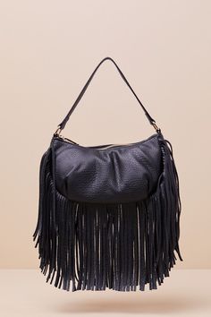 Spend Friday nights out on the town with the Bold Agenda Black Fringe Shoulder Bag! Pebbled faux leather shapes this elevated bag that features a crescent silhouette with a flat bottom design and a slender shoulder strap. Undo the top zipper to reveal a roomy, lined interior with a zippered sidewall pocket. Fun long fringe adorns the bottom of the bag for an eye-catching finish! Bag Measures 9. 5" Wide, 5. 25" Tall, And 3. 5" deep (Relaxed). 14" Shoulder Strap. Strap Has A 7. 25" DropLined. 100% UP. Imported. Lulus | Bold Agenda Black Fringe Shoulder Bag. Chic Evening Hobo Bag With Adjustable Handle, Chic Fall Bags For Night Out, Black Hobo Bag With Adjustable Handle For Evening, Trendy Hobo Bag With Adjustable Strap For Party, Evening Faux Leather Hobo Bag With Adjustable Strap, Leather Shoulder Bag With Zipper For Night Out, Chic Leather Shoulder Bag For Night Out, Night Out Crossbody Shoulder Bag With Detachable Handle, Evening Faux Leather Hobo Bag With Removable Pouch