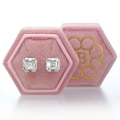 Enjoy a nice large look with this pair of asscher cut diamond stud earrings. The two lab grown diamonds total 10.14 ct (5.11 ct & 5.03 ct) and are IGI certified at F in color and VS1 in clarity. Colorless and very clean! The diamonds are set in 14k white gold settings. These asscher diamond studs will sparkle for a lifetime! Octagon Diamond Cut Earrings For Gift, Octagon Diamond Cut Earrings As Gift, Gift Diamond Cut Octagon Earrings, Gift Octagon Diamond Cut Earrings, Luxury White Asscher Cut Diamond Earrings, Luxury Asscher Cut Diamond Earrings With Accents, Luxury Emerald Cut Diamond Earrings Gift, Luxury White Asscher Cut Earrings, Luxury Silver Asscher Cut Diamond Earrings