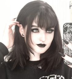 mavis 
mavis makeup 
goth makeup 
alternative 
alternative makeup
goth girl Long V Bangs, Pointy Bangs Goth, Gothic Hair With Bangs, Short Hair With V Bangs, V Bangs Goth Short Hair, Goth Haircuts Long, V Shaped Bangs Goth