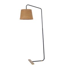 a floor lamp with a brown shade on it