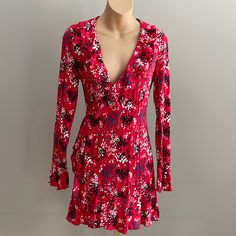 Like Brand New Urban Outfitters Wrap Dress Size S/P. Double Tie Closure, Ruffle At Wrists, Front And Bottom, Red Floral Print. I Wore This As A Dress Or With Leggings And Boots And Is So Cute Wearing Different Ways! Flirty Red Floral Print Dress, Red Long Sleeve Lined Dress, Red Printed Mini Dress, Red Printed Mini Dress For Spring, Red V-neck Lined Mini Dress, Red Fitted Mini Dress With Floral Print, Red Fitted Floral Print Mini Dress, Urban Outfitters Fitted V-neck Mini Dress, Fitted V-neck Mini Dress By Urban Outfitters