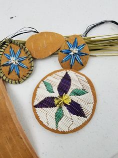 three wooden ornaments are sitting on a table