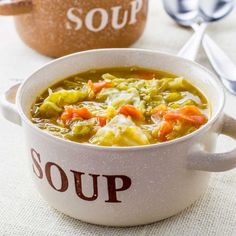 a bowl of soup sitting on top of a table