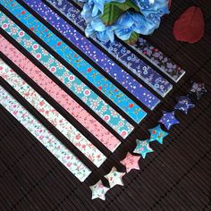 several different colored stars and flowers on a table