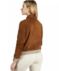 Women's Suede Bomber Leather Jacket In Dark Brown Crafted from luxurious goatskin, this women's suede bomber leather jacket features a plush suede finish for a sophisticated touch. The interior is lined with soft viscose, ensuring comfort and warmth. A sleek zipper closure, turtle neck collar, and rib knit cuffs offer a snug fit, while two side zip pockets and an inside pocket provide practicality. The dark brown hue adds a classic, versatile appeal. Outer Shell: Genuine Leather Leather Type: Goatskin Leather Finish: Suede Inner Shell: Viscose Lining Closure Style: Zipper Collar Style: Turtle Neck Cuffs Style: Rib Knit Inside Pockets: One Outside Pockets: Two Side Zip Pockets Color: Dark Brown Luxury Suede Leather Jacket For Fall, Casual Suede Leather Jacket With Suede Overlays, Casual Suede Jacket With Suede Overlays, Casual Suede Leather Jacket With Overlays, Fall Suede Leather Jacket With Suede Lining, Leather Shorts Women, Short Leather Skirts, Leather Jumpsuit, Shearling Vest