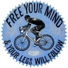 a man riding a bike with the words free your mind and your legs will follow