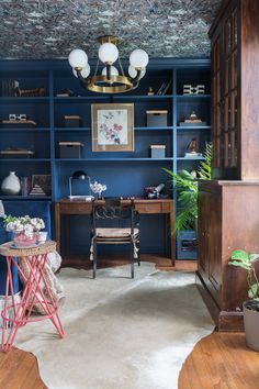 a room with blue walls and wooden floors