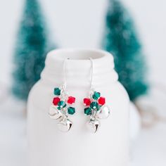 Get holiday ready in no time with these adorable jingle bell earrings. Pair these earrings with a cream sweater and grey wool pants for a refined and sophisticated holiday look. These make a great gift for your child's teacher or as a stocking stuffer for mom. Size - 1.5" long, 4mm crystals, 9mm bells (these really do jingle!) Materials - Swarovski crystals Metals - silver plated components, bells, and ear wires Adjustable Earrings For Christmas Gift, Adjustable Earrings As A Christmas Gift, Winter Festive Dangle Earrings, Stocking Stuffers For Mom, Winter Earrings, Holiday Ready, Sparkly Earrings, Green Jewelry, Holiday Earring